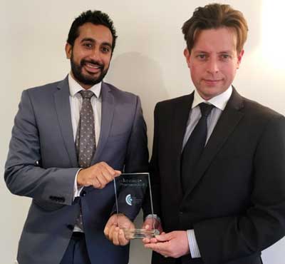 Mark Williams Chief Audiologist (r) and Rekesh Patel Harley St, London Region Manager and Senior Audiologist (l) with the award